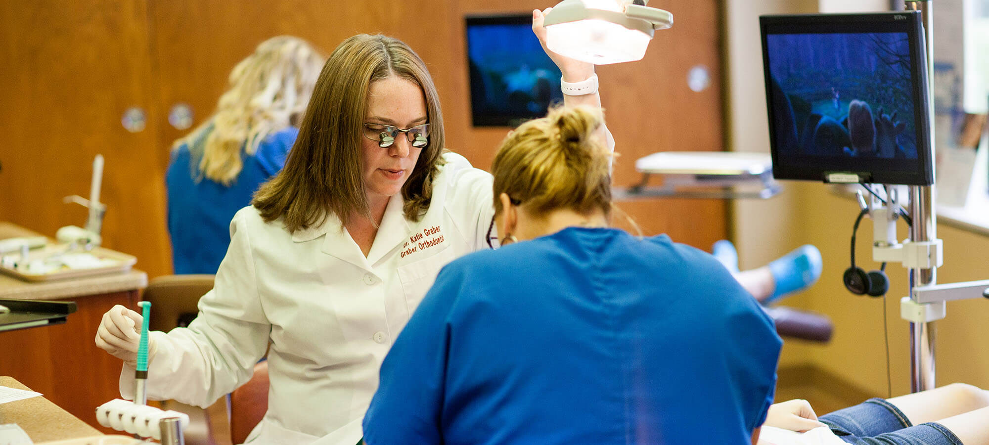 Katie Graber adjusting braces